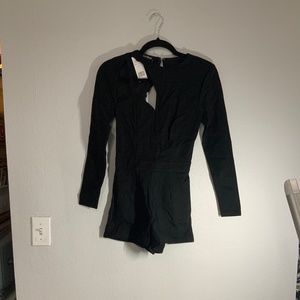 Bebe long sleeve cutout romper. New. Size: 0 & 4